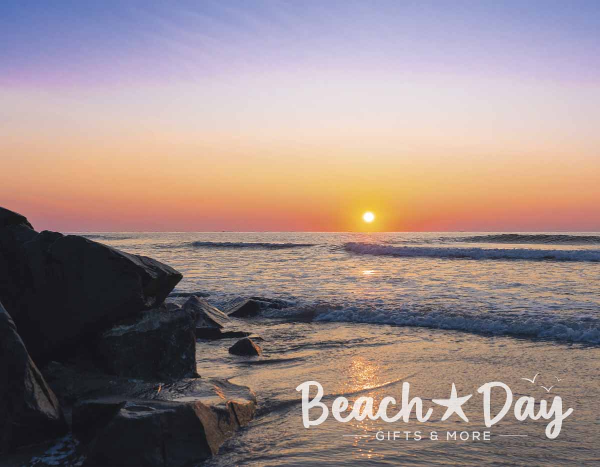 Sunrise over the ocean and rocks in Wildwood, New Jersey