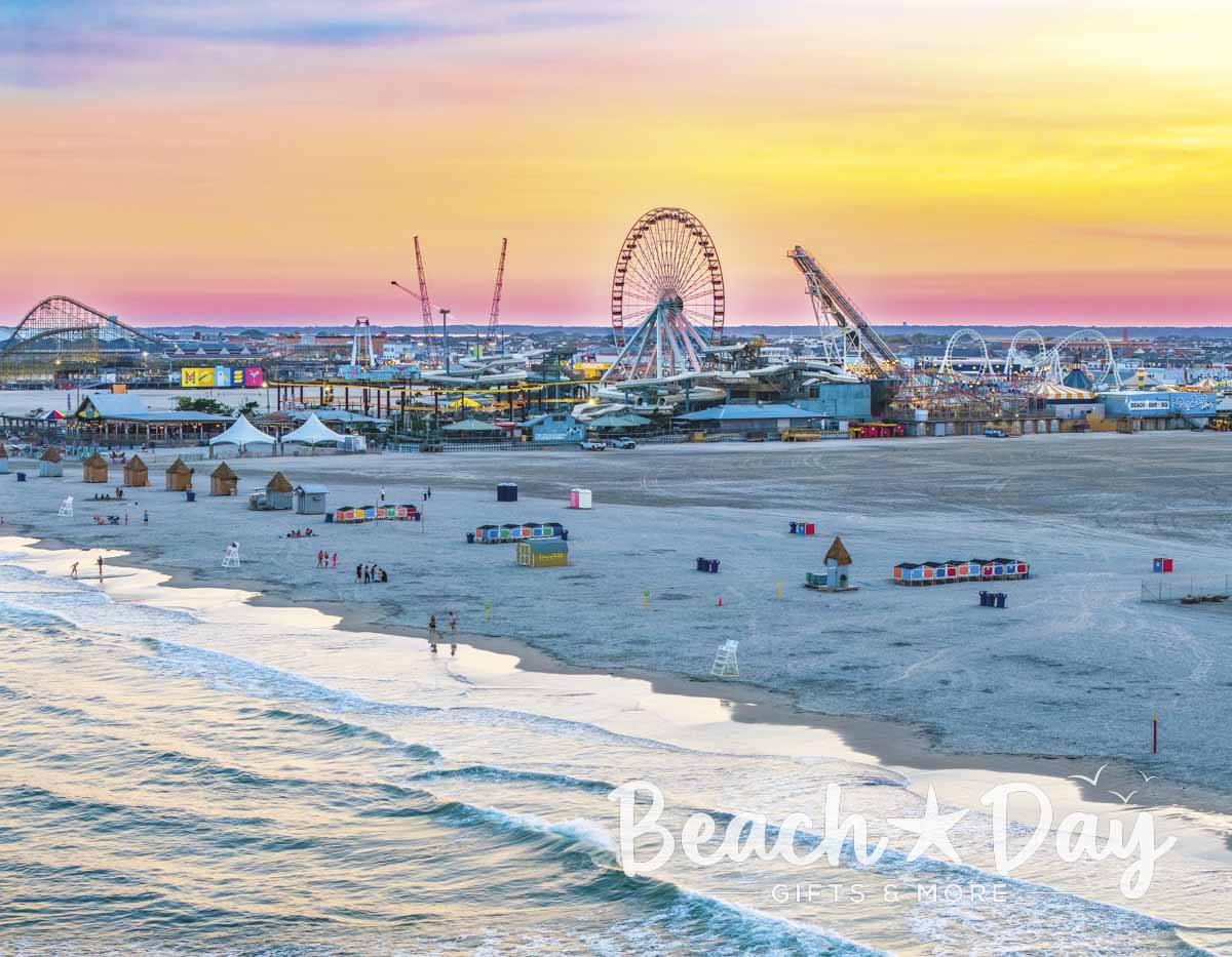 Wildwood beach and boardwalk amusement piers at sunset