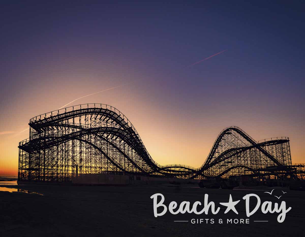 Wildwood wooden roller coaster silhouetted against the sunset